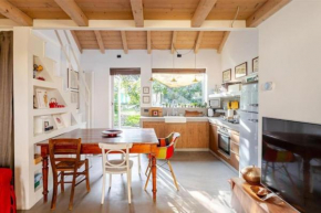 Tiny House on Water Surrounded by Greenery Milano
